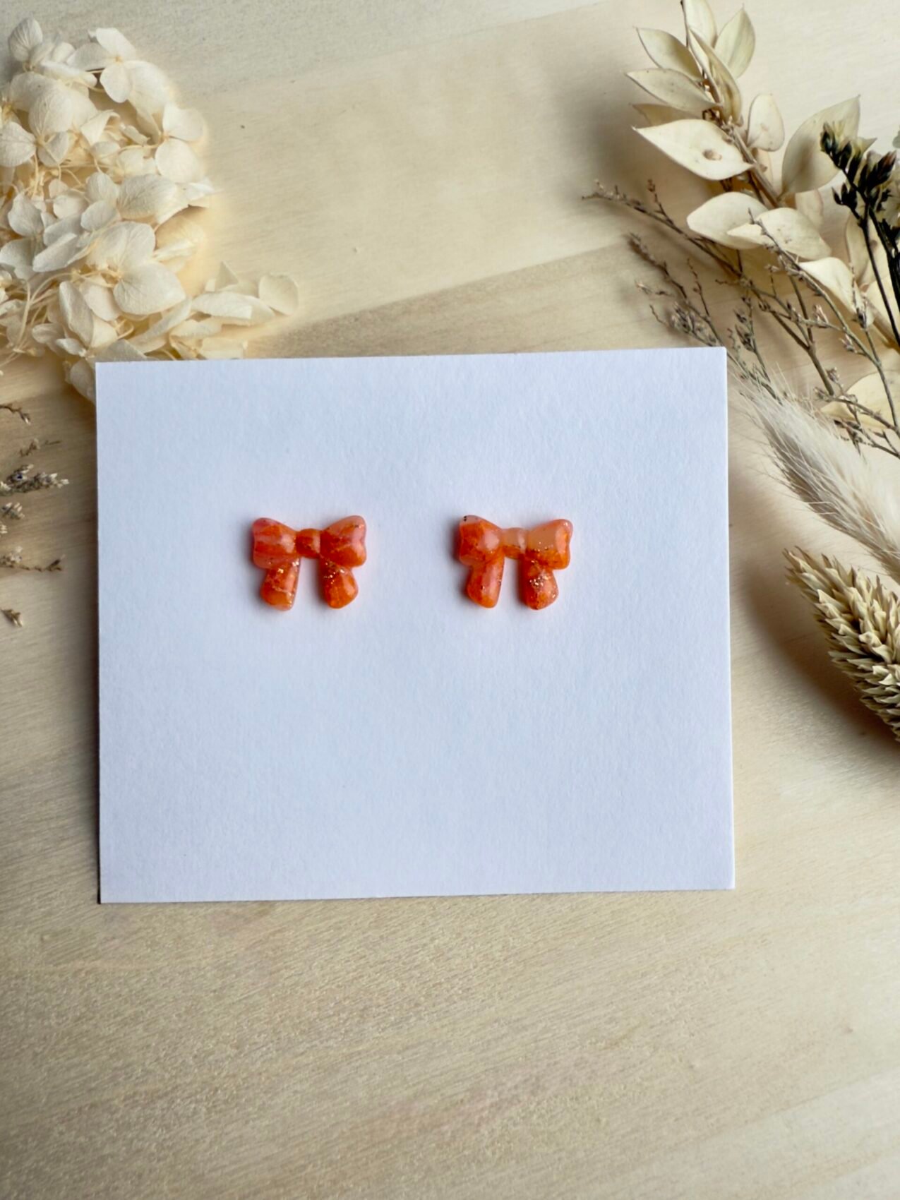 Kolczyki Kokardki marmurkowe - pomarańczowe